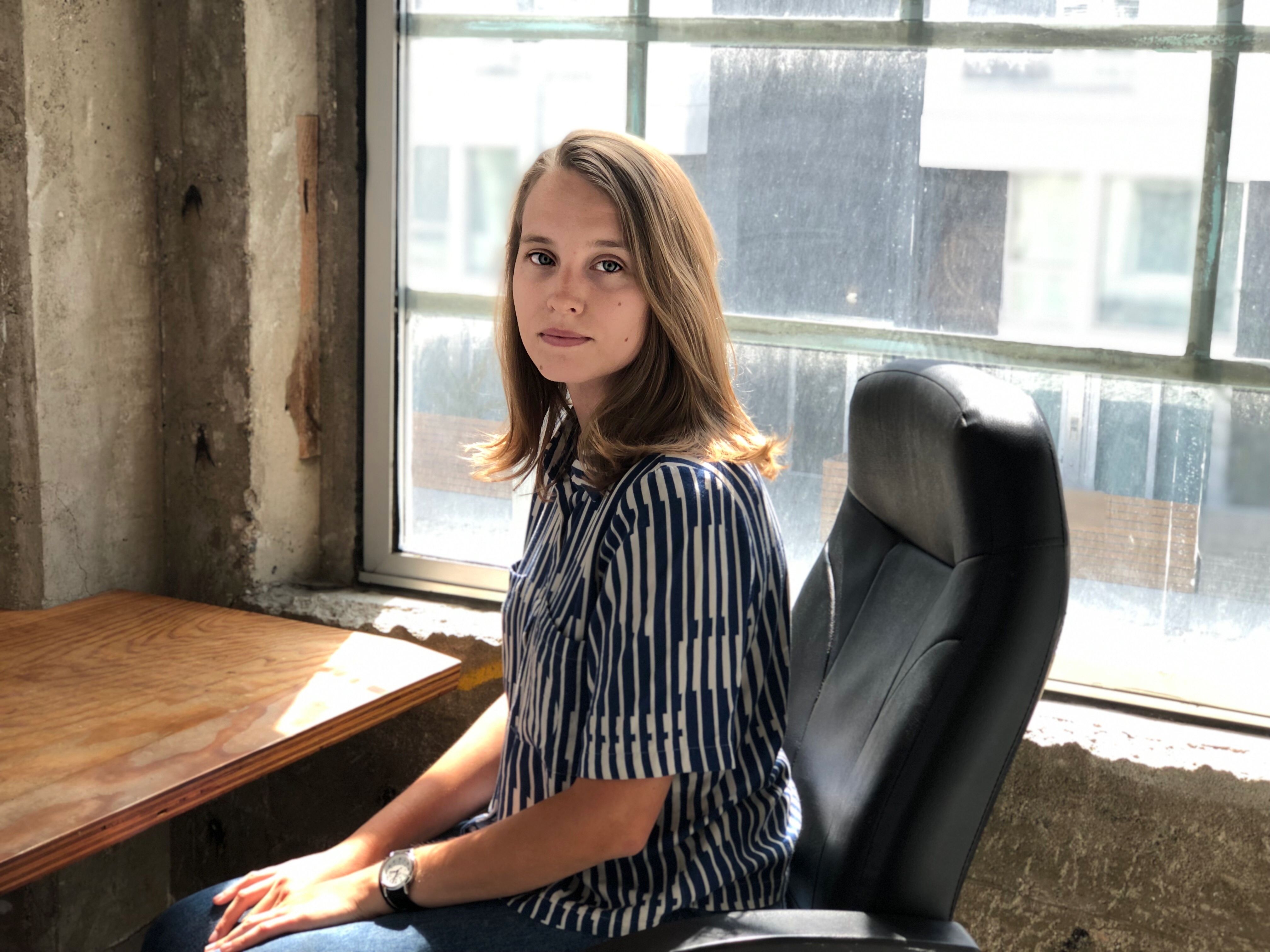 girl sitting desk window