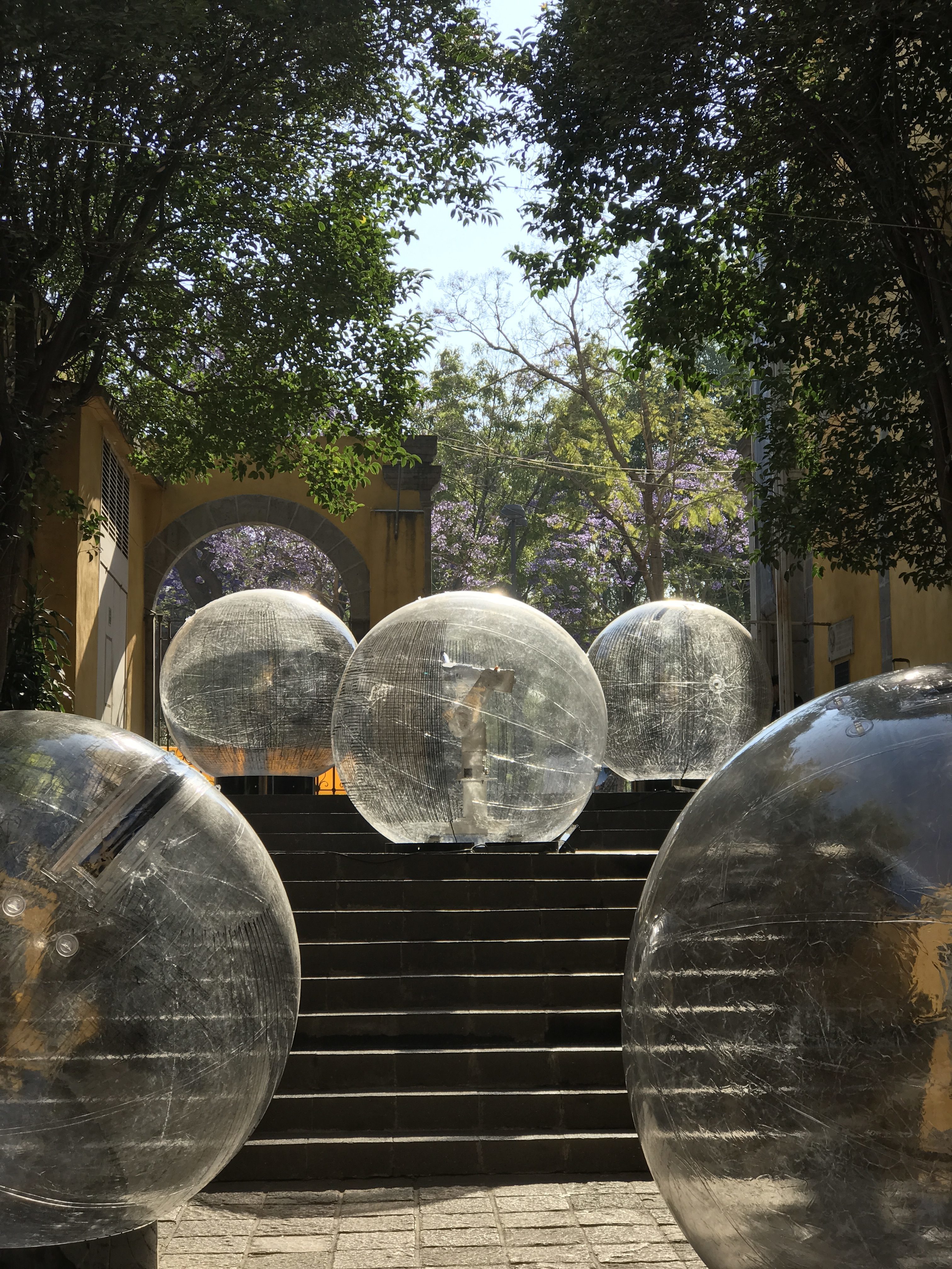 Robotic arms inside clear sphere balls