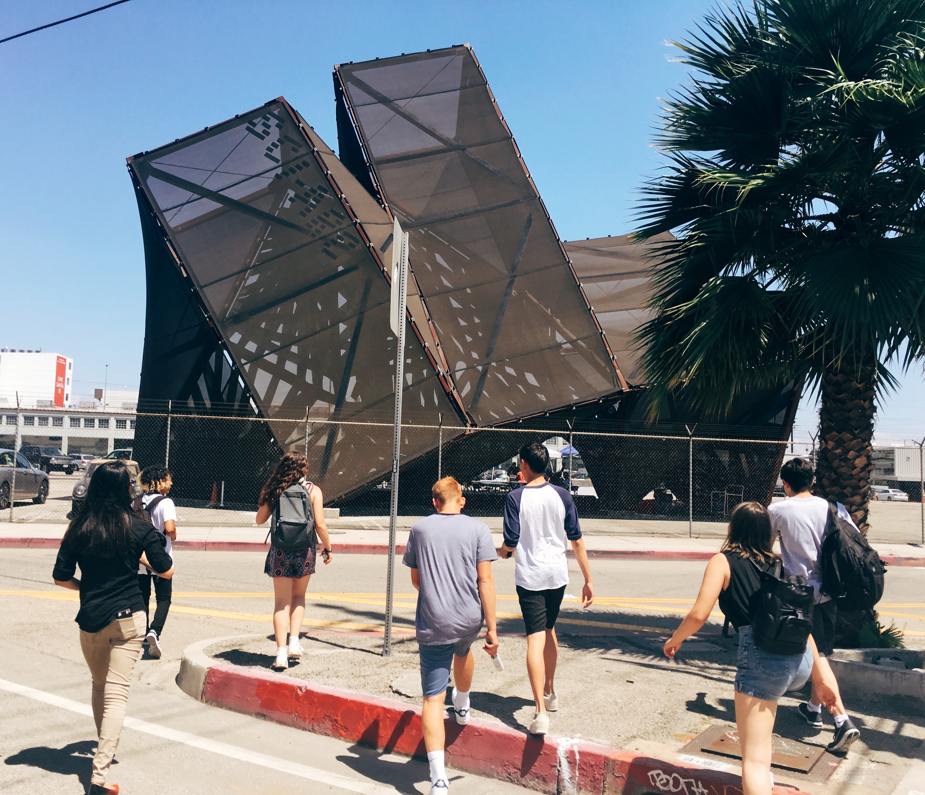 students walking towards sciarc gratuation pavilion