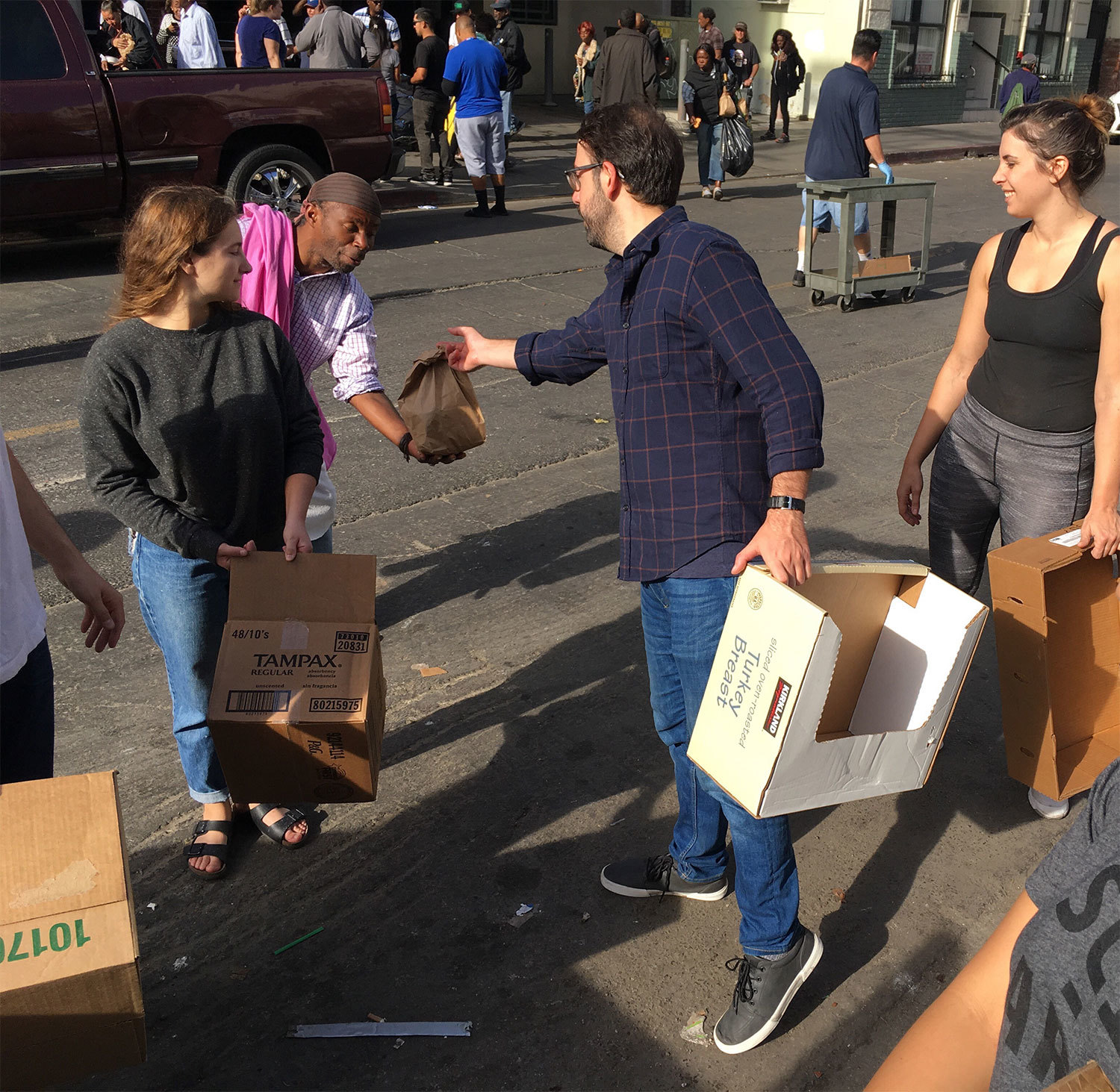 SCI-Arc students handing out care packages to homeless people