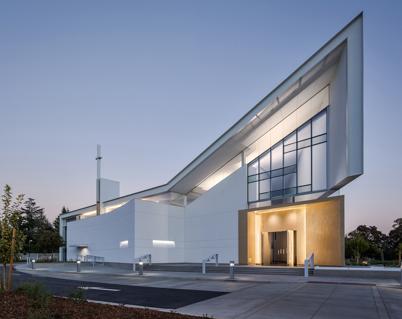 a white building with a single pitched roof