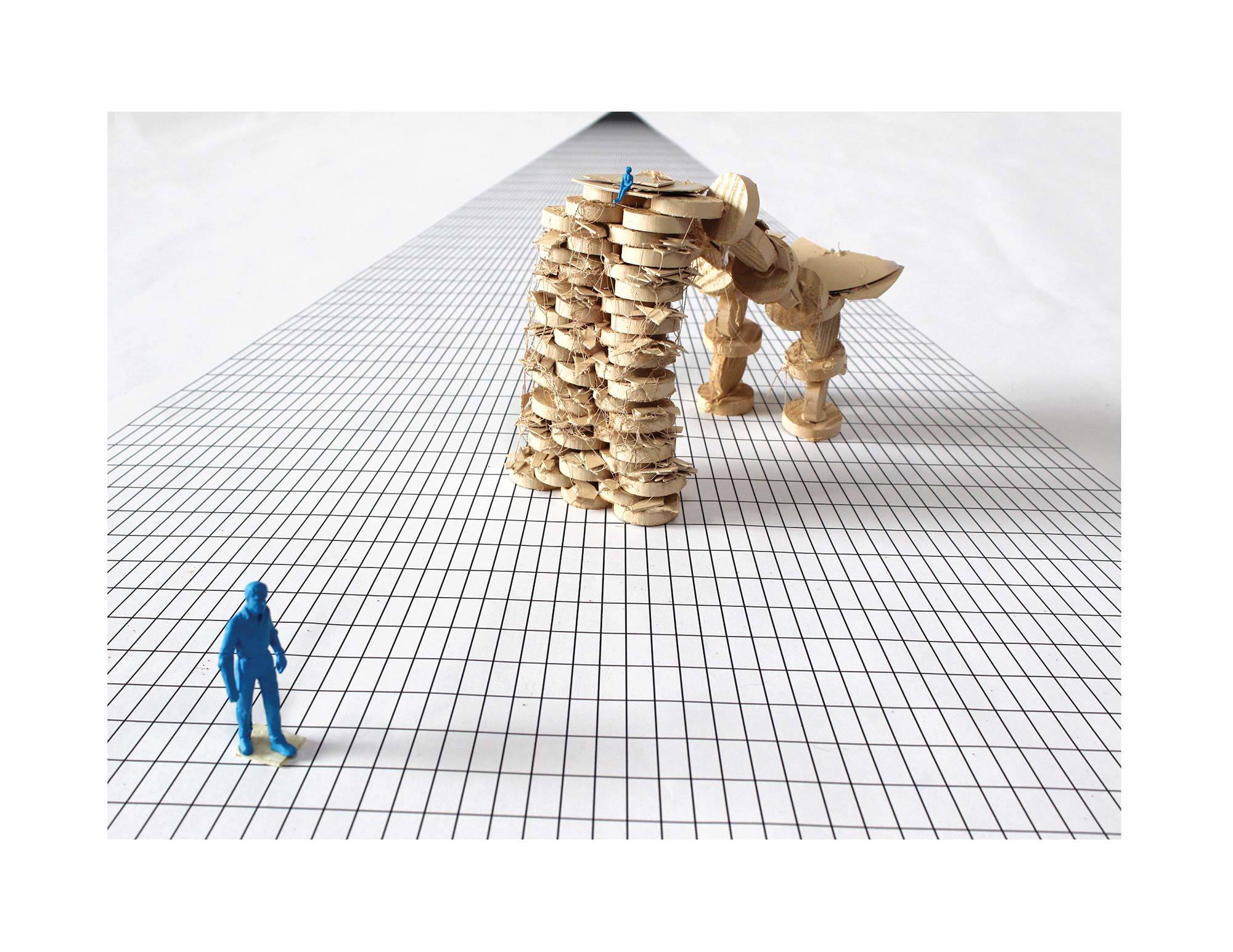 model made of circular wooden chips stacked to build a archway on checkered grid