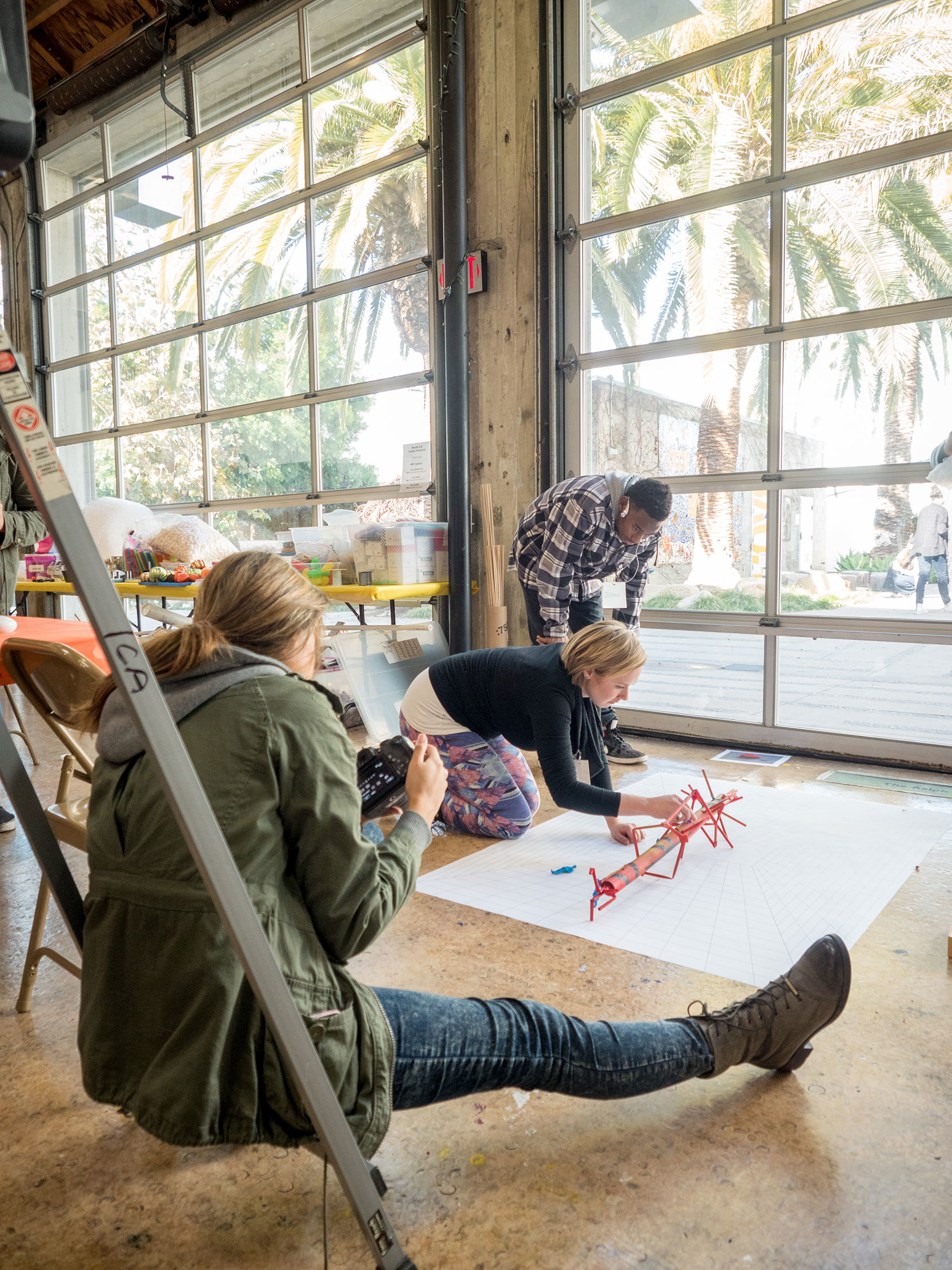 students work photographing architectural model