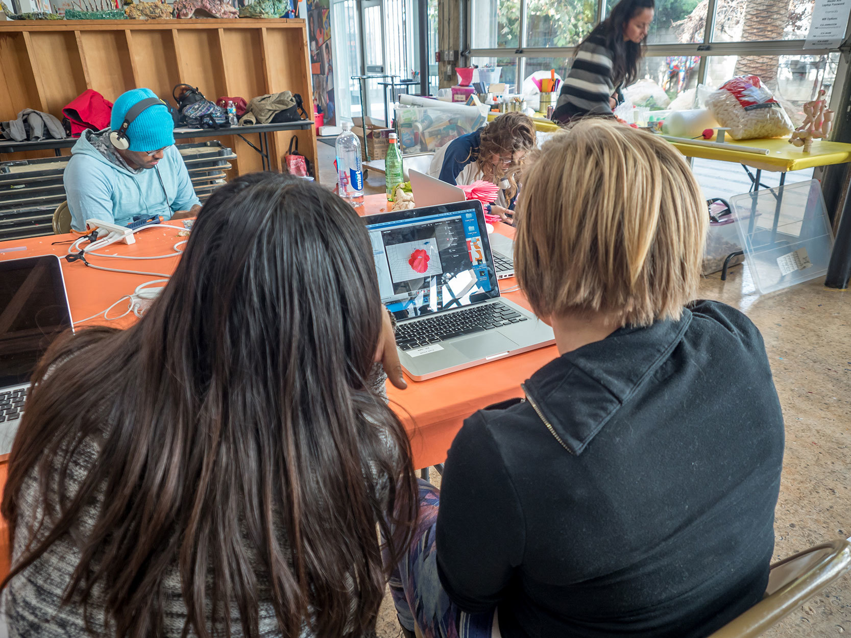 Inner City Arts students work at laptop