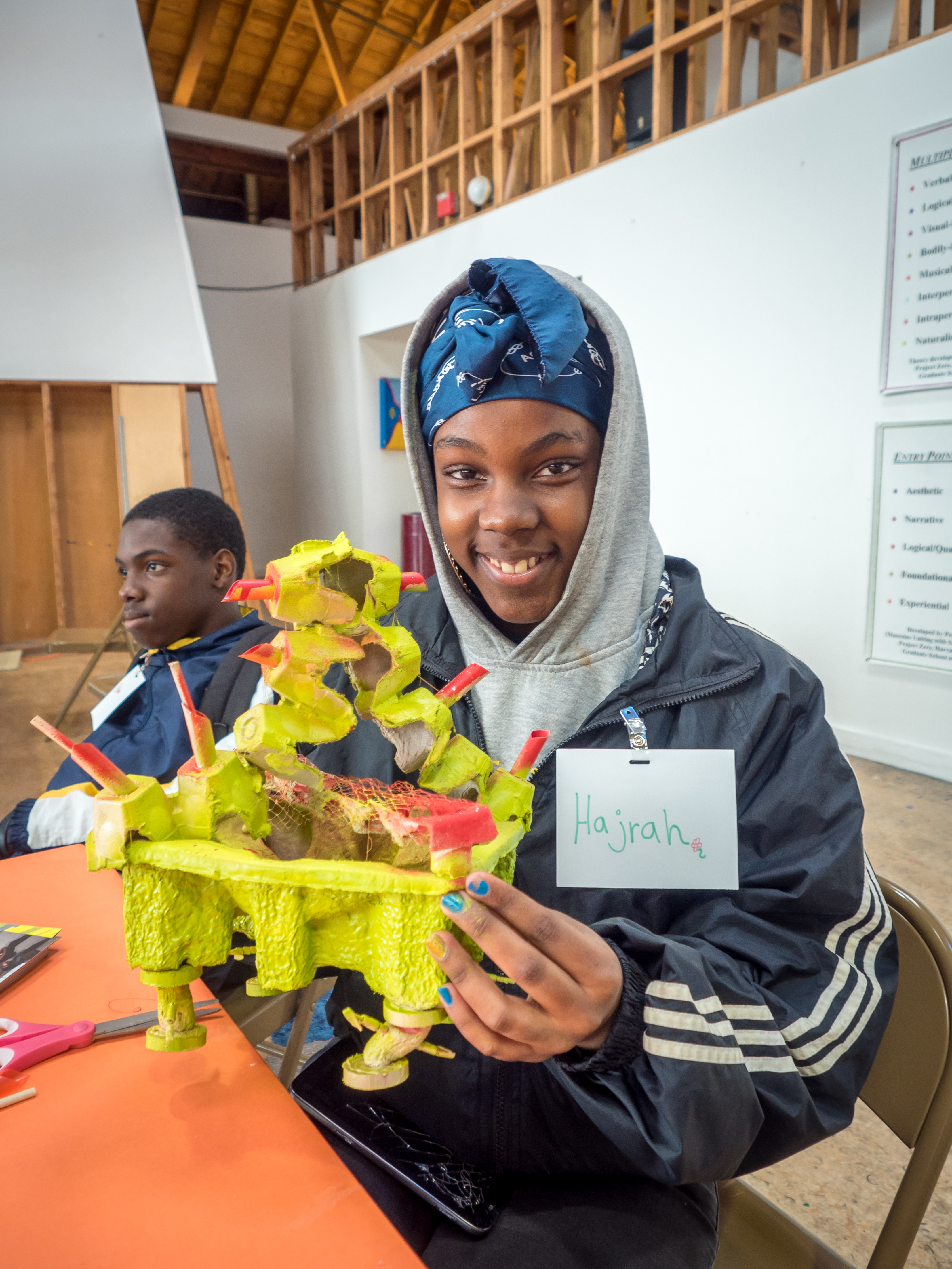 Inner City Arts student holding architectural model