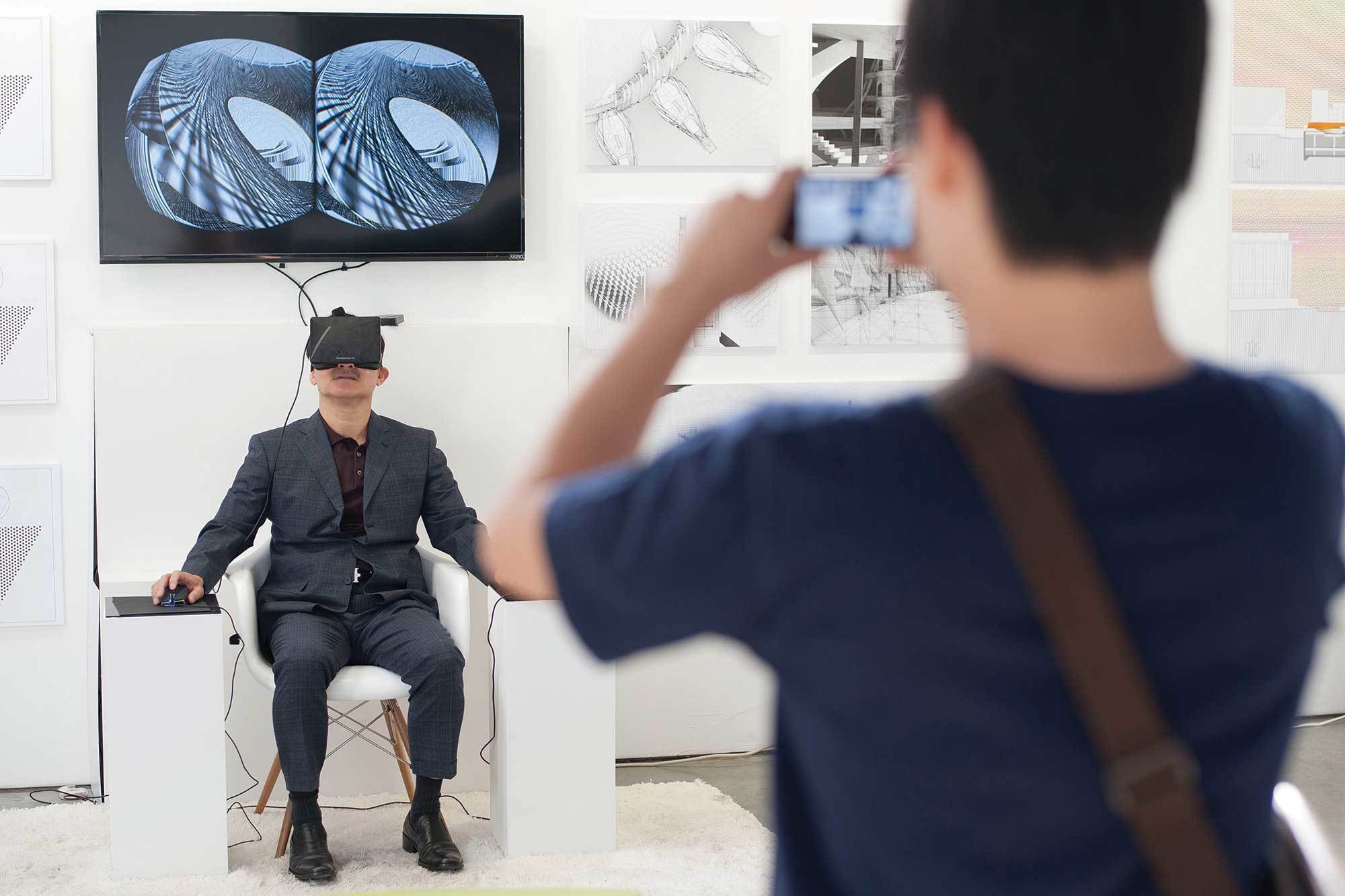 man in VR photographed by viewer exhibition