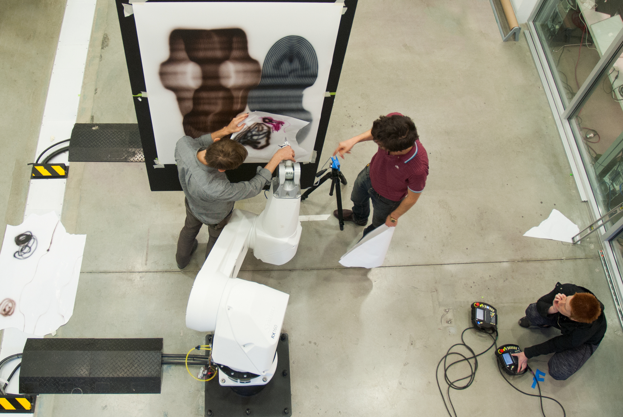 students making drawings with robots