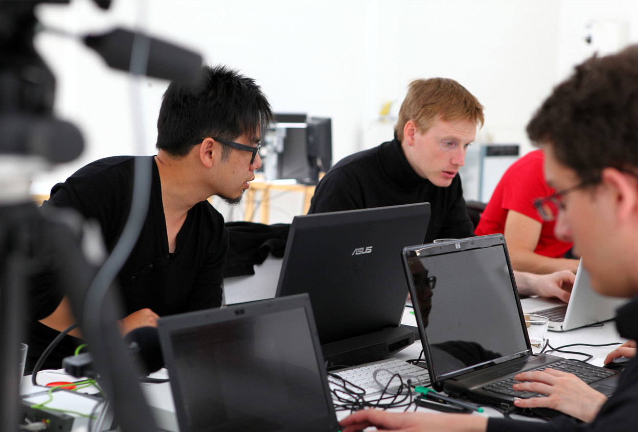 Steven Ma with students in a digital laboratory