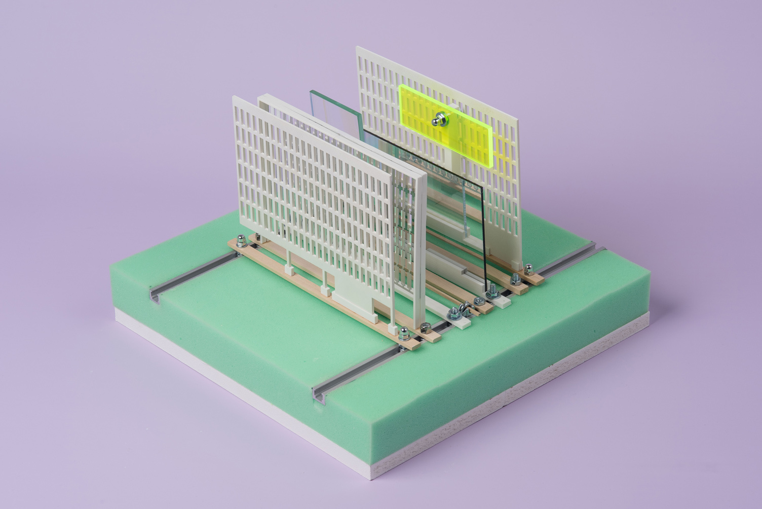 architecture model with aquamarine base on lavender background