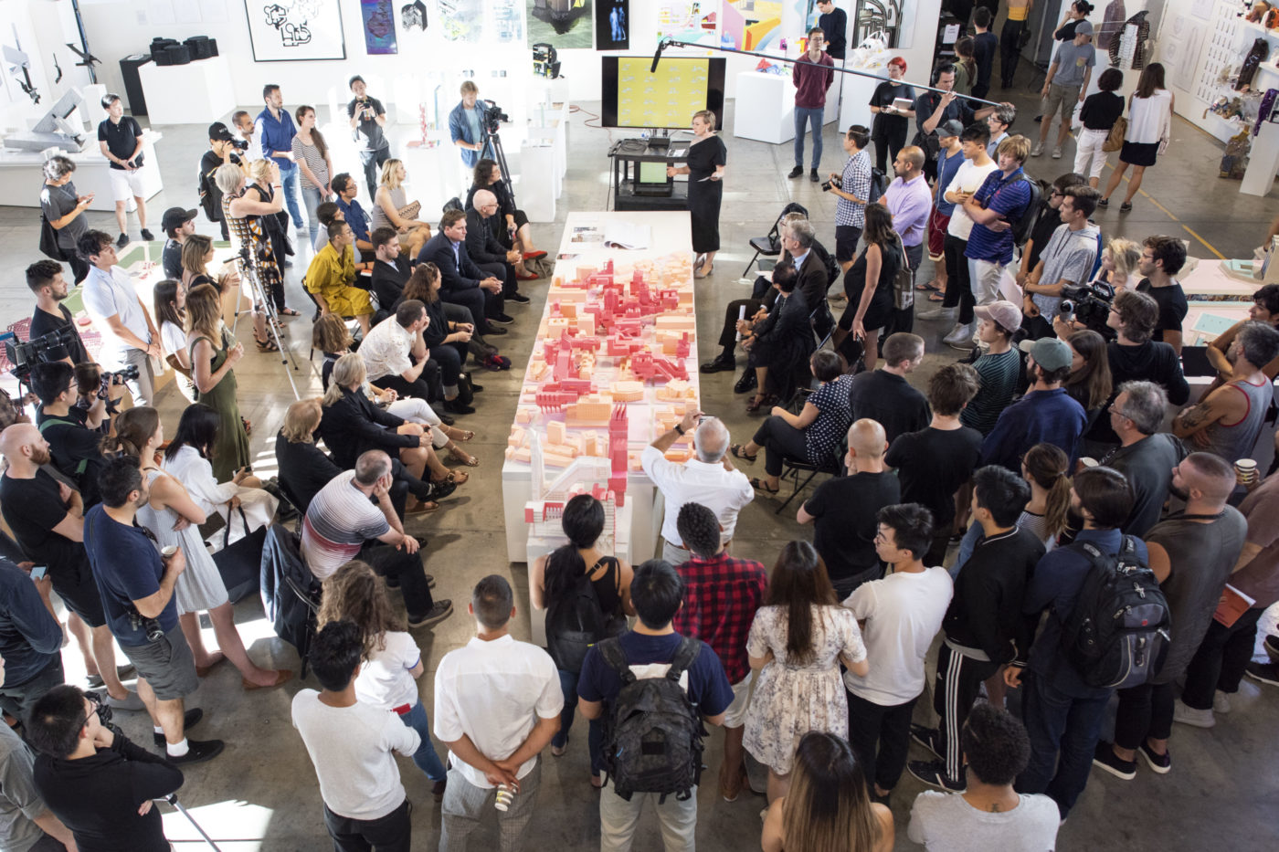 large crowd around model at thesis