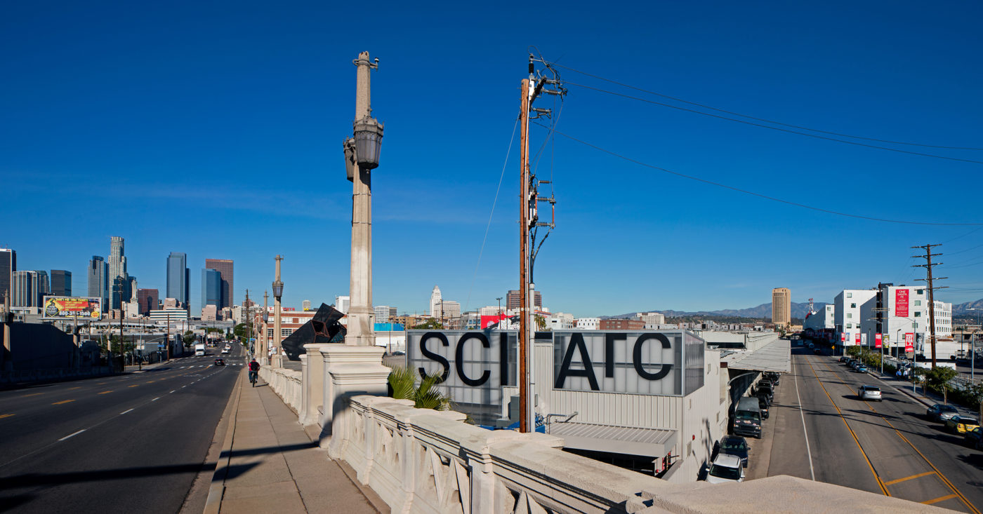 Sciarc exterior black graphic logo on transparent blackground from 6th Street Bridge in downtown los angeles with blue sky