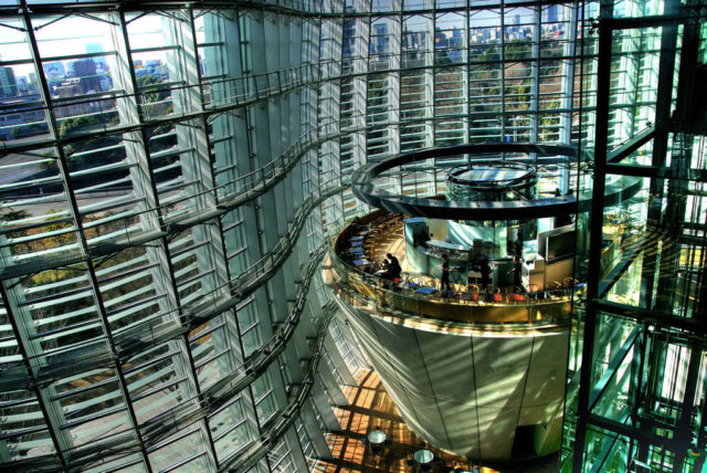 curved glass facade building interior mezzanine shot