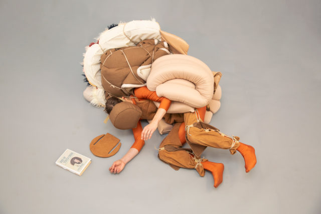 person cushion suit orange tan