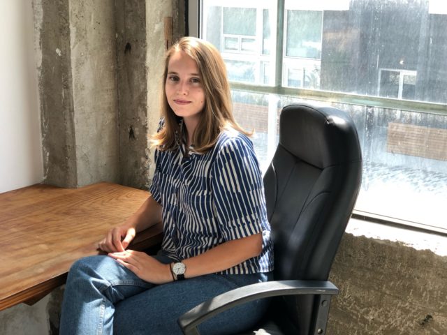 girl sitting desk window