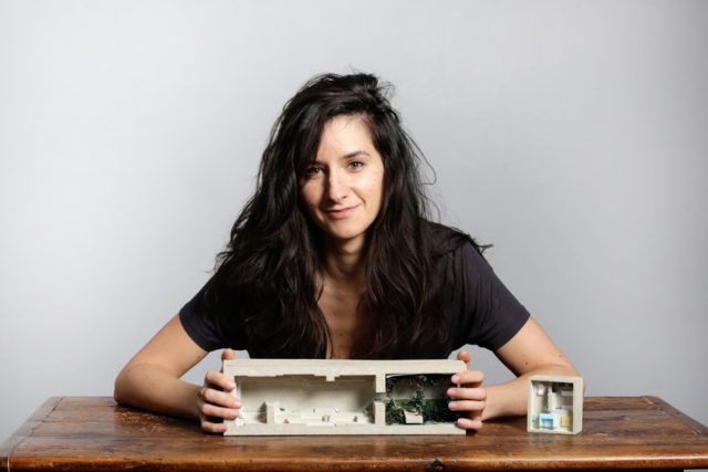 Oana Stanescu, with an architectural model