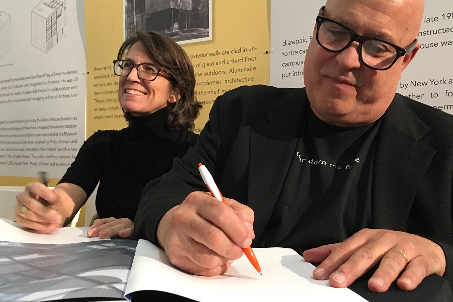 Angela Scarpa and Lawrence Brooks architect architects signing portrait