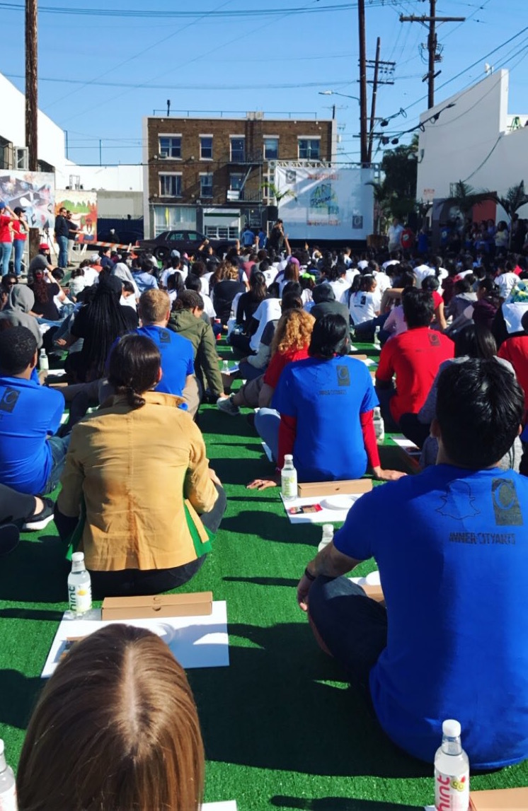 participants of fundraiser sitting on turf