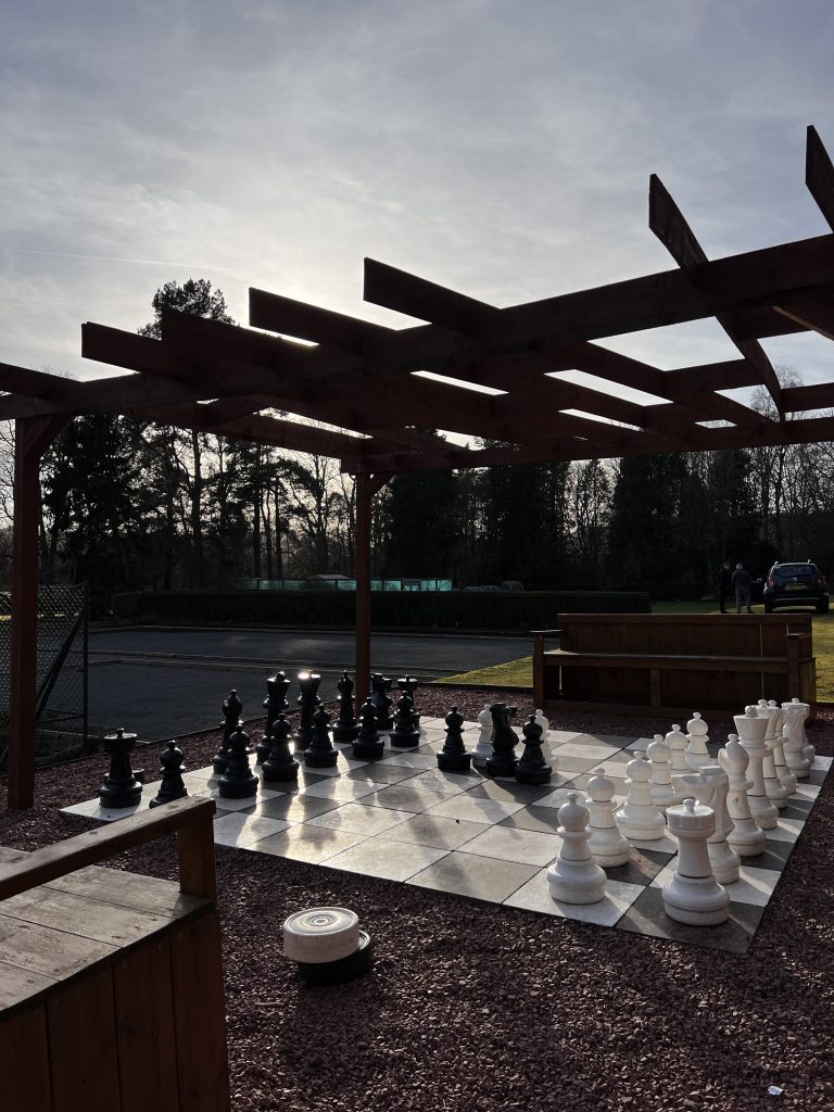 Outdoor giant chess or checkers game for guests at Peebles Hydro Hotel.