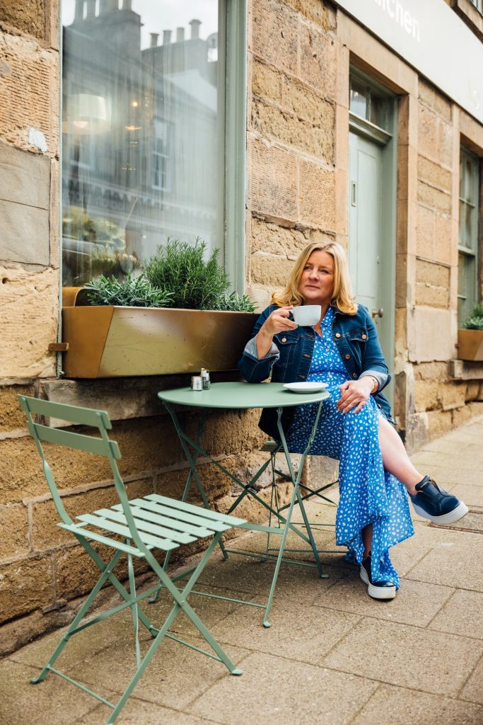Suzanne Mulholland drinking a cup of coffee in the Scottish Borders.