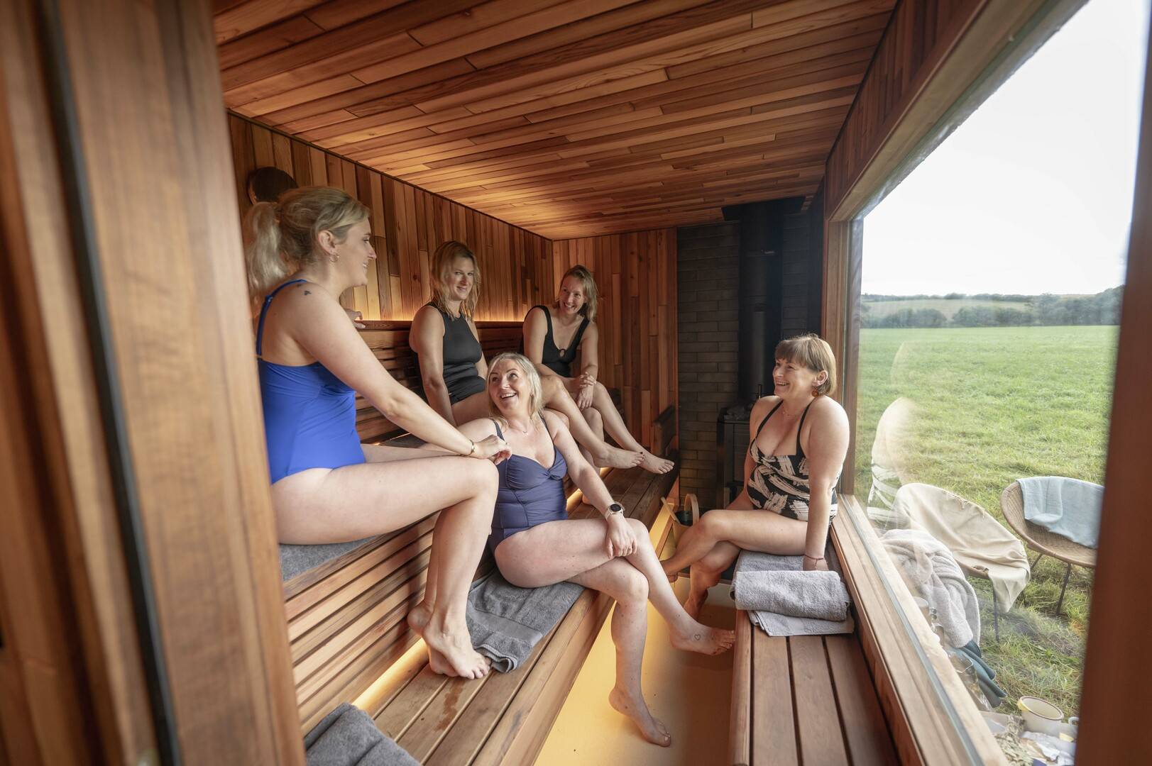 People enjoying a sauna and chat after a hard exercise session - optional cold plunge available!, Cedar Hus / Phil Wilkinson Photography