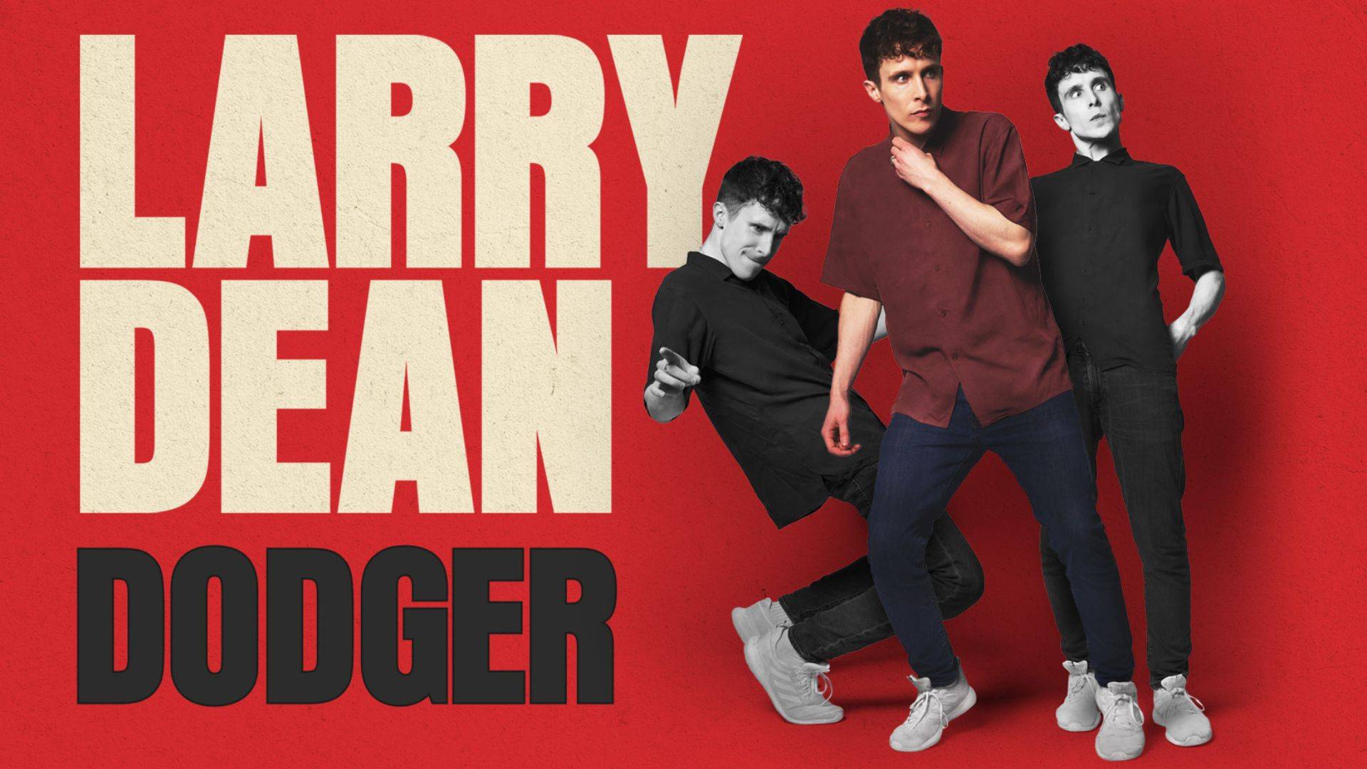 The comedian Larry Dean looking thoughtful against a red background.