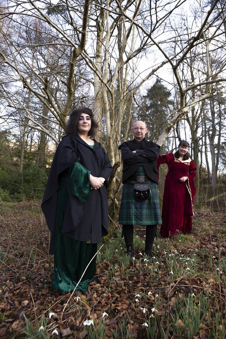 The Mostly Ghostly team dressed in historical costume, standing within an atmospheric wooded glade, Allan Devlin