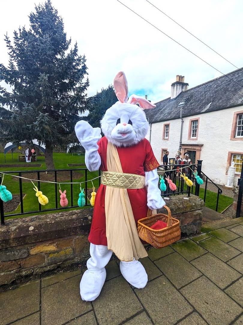 Remus the Roman Rabbit in front of Abbey House Gardens, Trimontium Trust