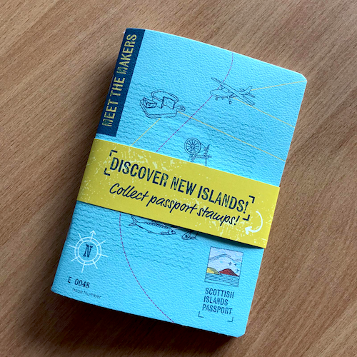 Photograph of the Meet the Makers travelogue on a wooden surface