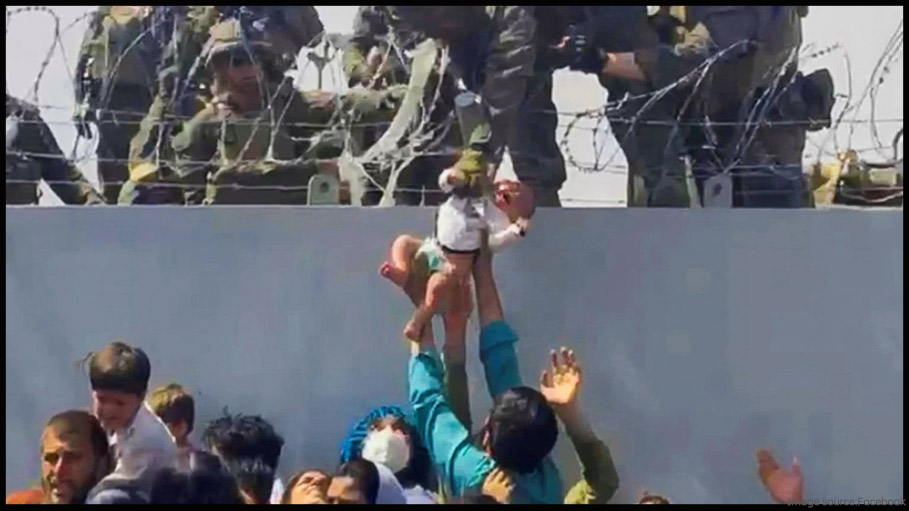 Kabul: Heartbreaking Video Shows US Marine Lifting Baby Over Barbed Wire