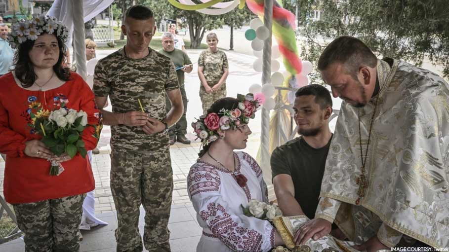 Bride in Camouflage Trousers at Wedding as Life Goes on in Ukraine