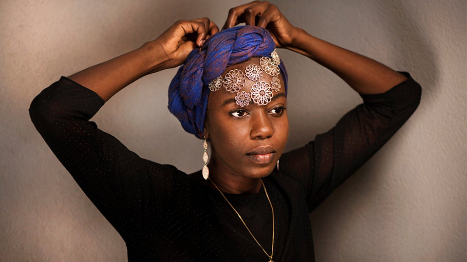 Slam Poet Emi Brings Refugee Voices to COP26: "Earth Began to Purge Us Too"