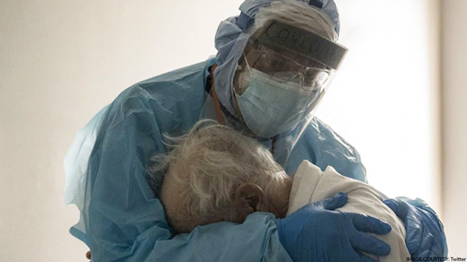 Heartbreaking Photo Shows Doctor Comforting Elderly Covid Patient