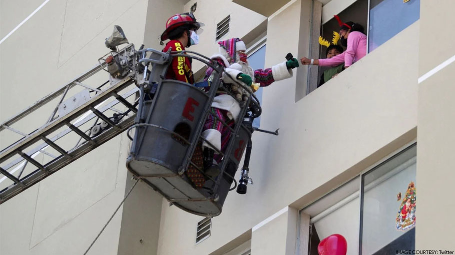 Santa Hops on Fire Truck to Bring Christmas Cheer to Children Infected with Covid