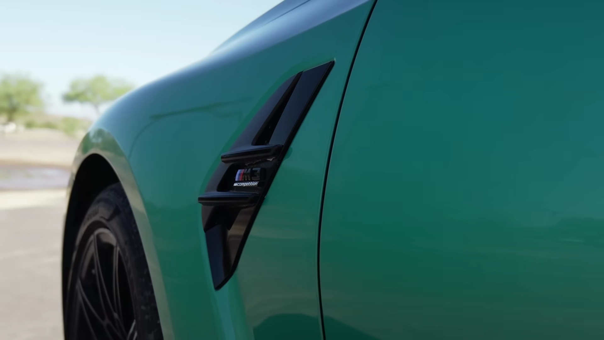 The BMW M3's engine bay compared to the Tesla's electric architecture.