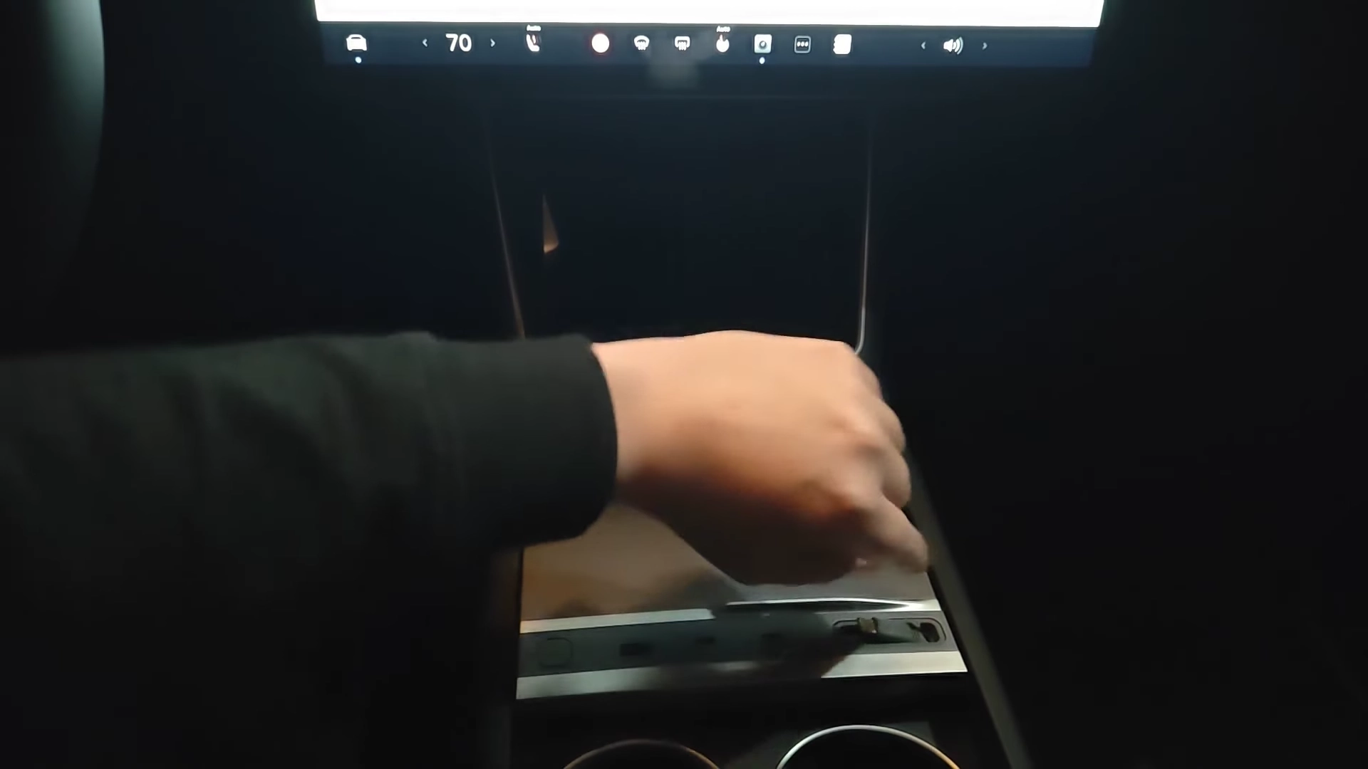 A customized USB hub accessory installed in the center console for efficient wired charging.