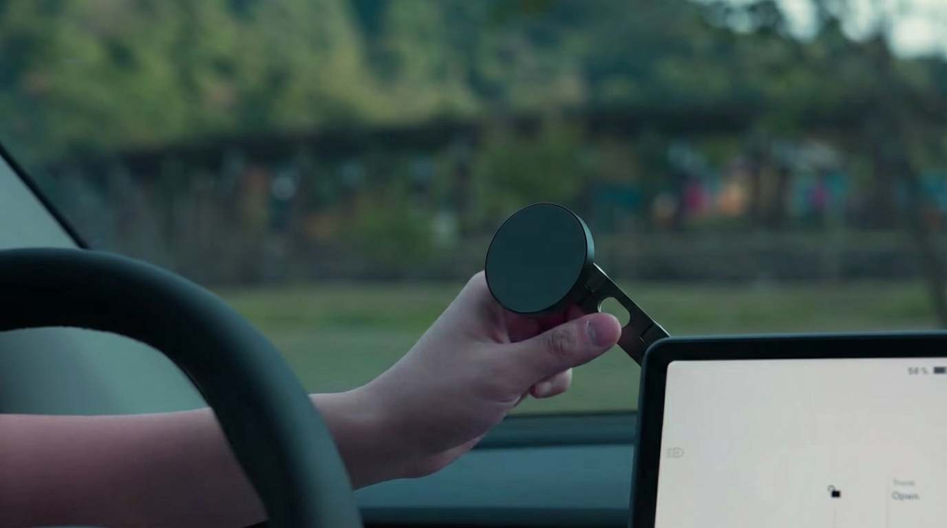 A demonstration of why a phone mount is necessary, preventing the phone from sliding during acceleration.