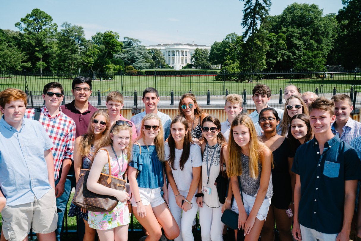Group of students posing for a photo in front of the White House in Washington, D.C.