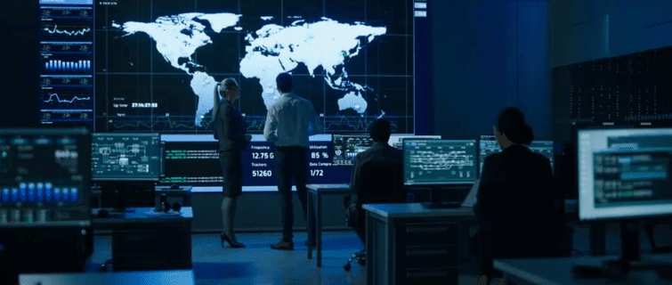 Telecommunications control room with people working