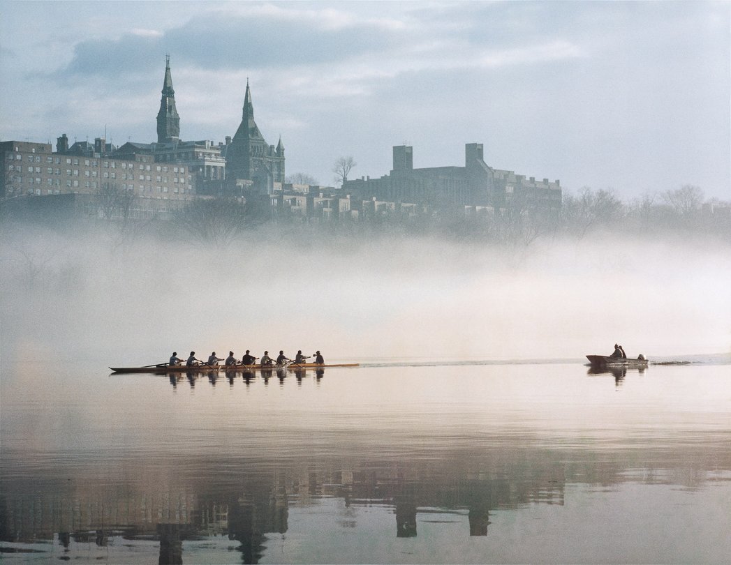 Rowers on the Potomac with Georgetown in the distance.