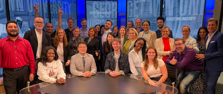 A group of German journalists mixed in with a group of Georgetown journalism students.