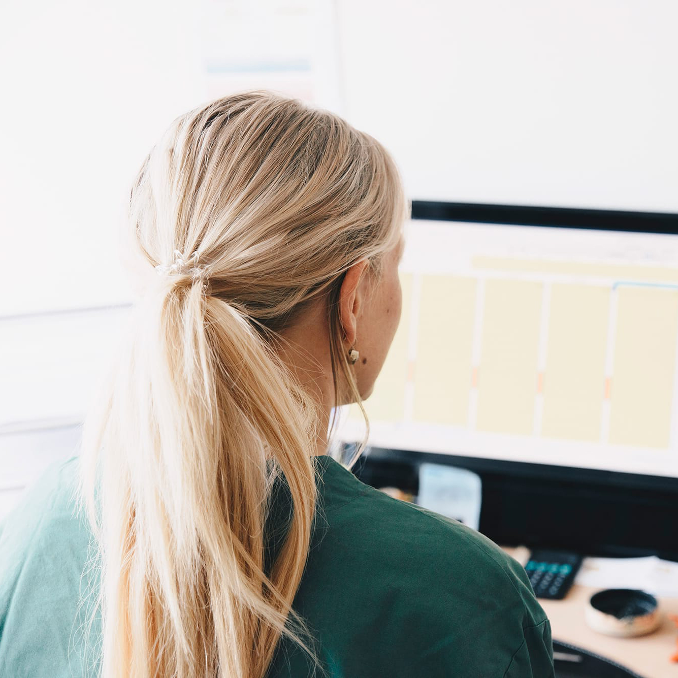 Woman working on a computer.