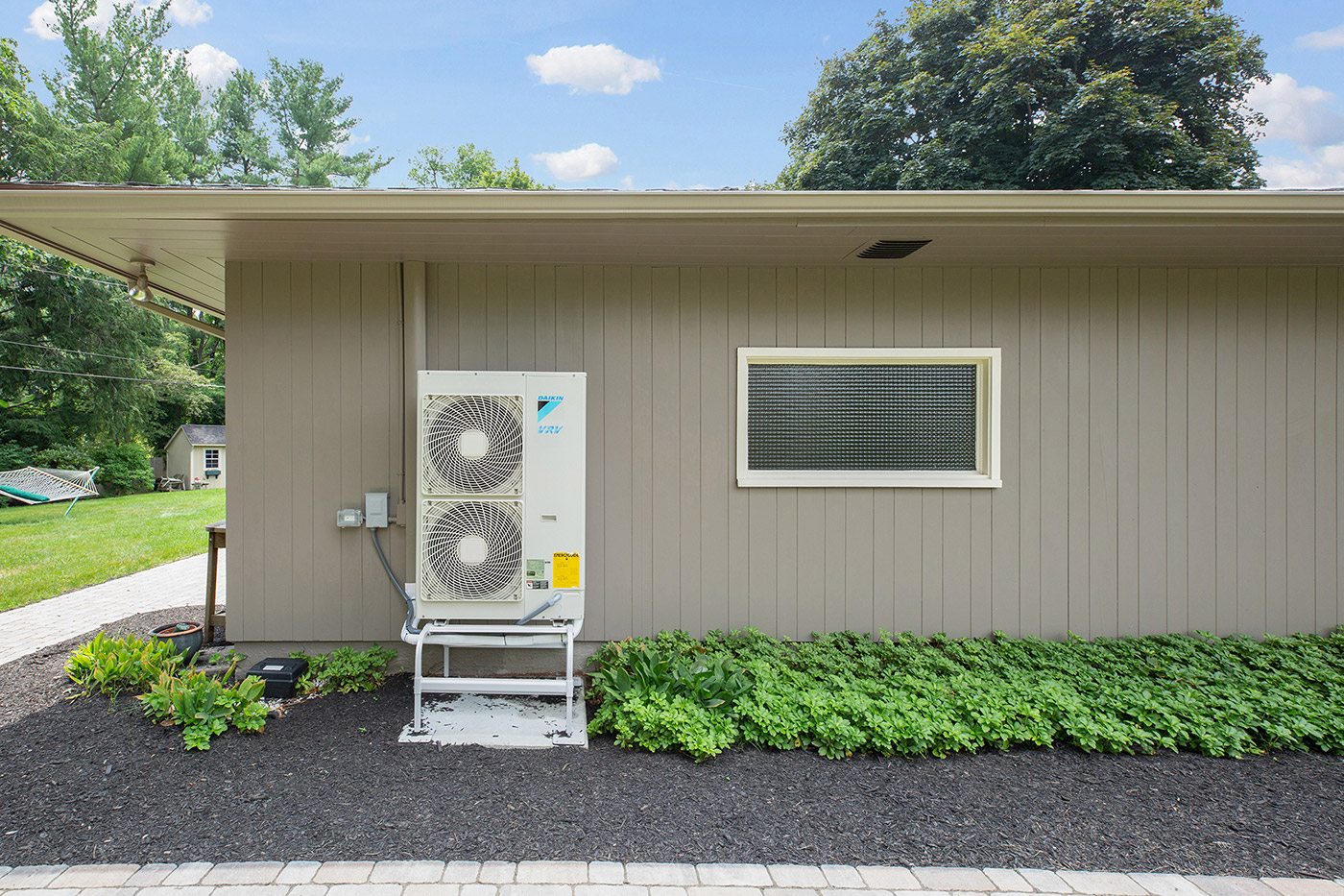 Imaage of heat pump outside of a house