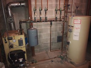 Older HVAC system located in basement of home