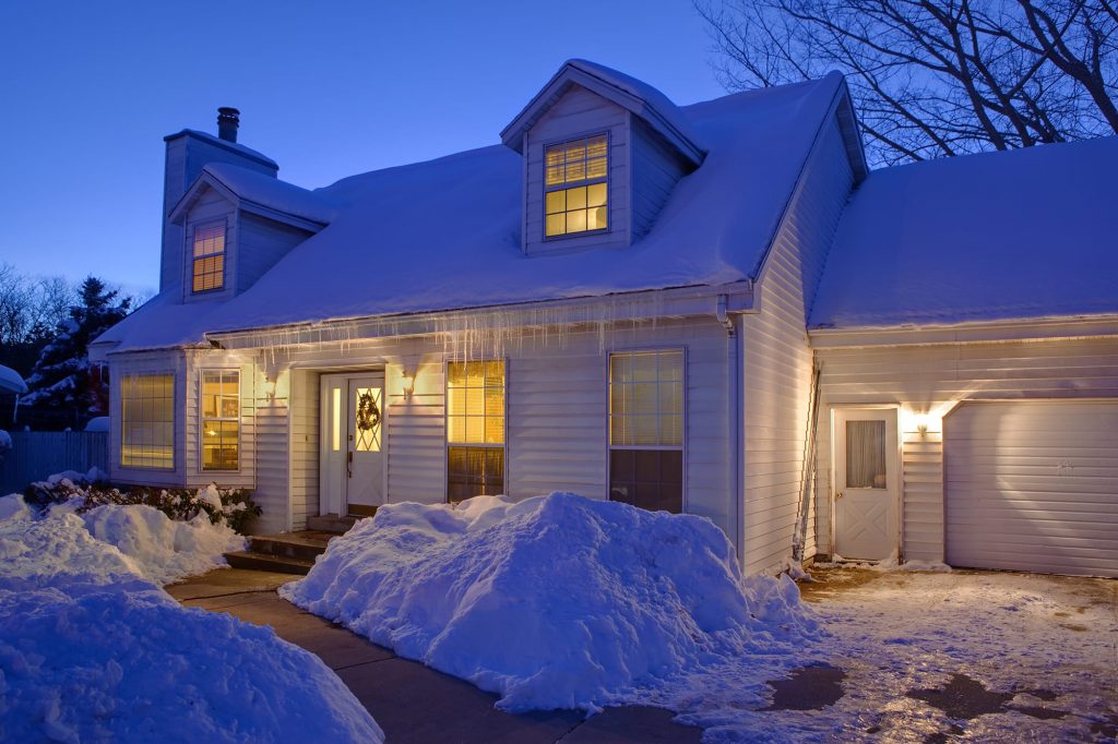 house covered in snow during winter