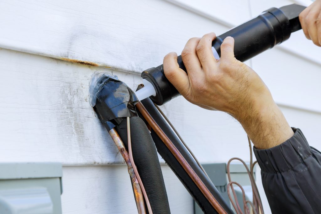 Check for air leaks caused by cracked or missing caulk around fixtures and electrical