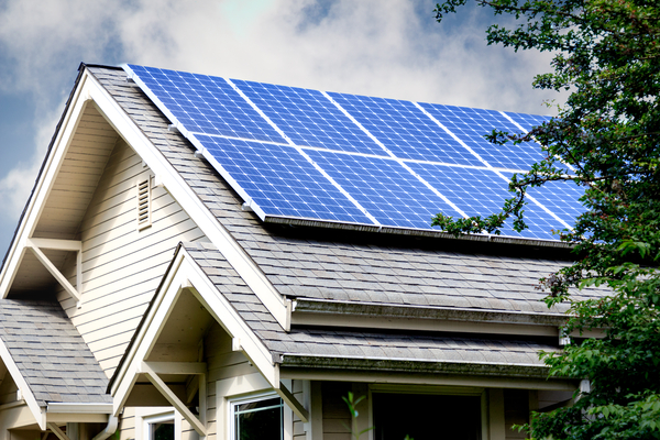 Exterior of home with solar panels on roof to illustrate there are some solar incentives available in Wisconsin