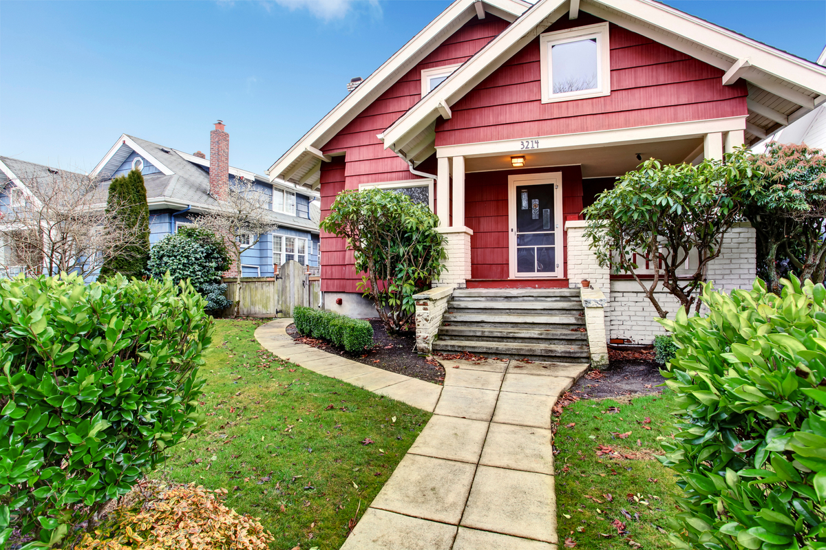 Exterior of cheerful, red craftsman style home