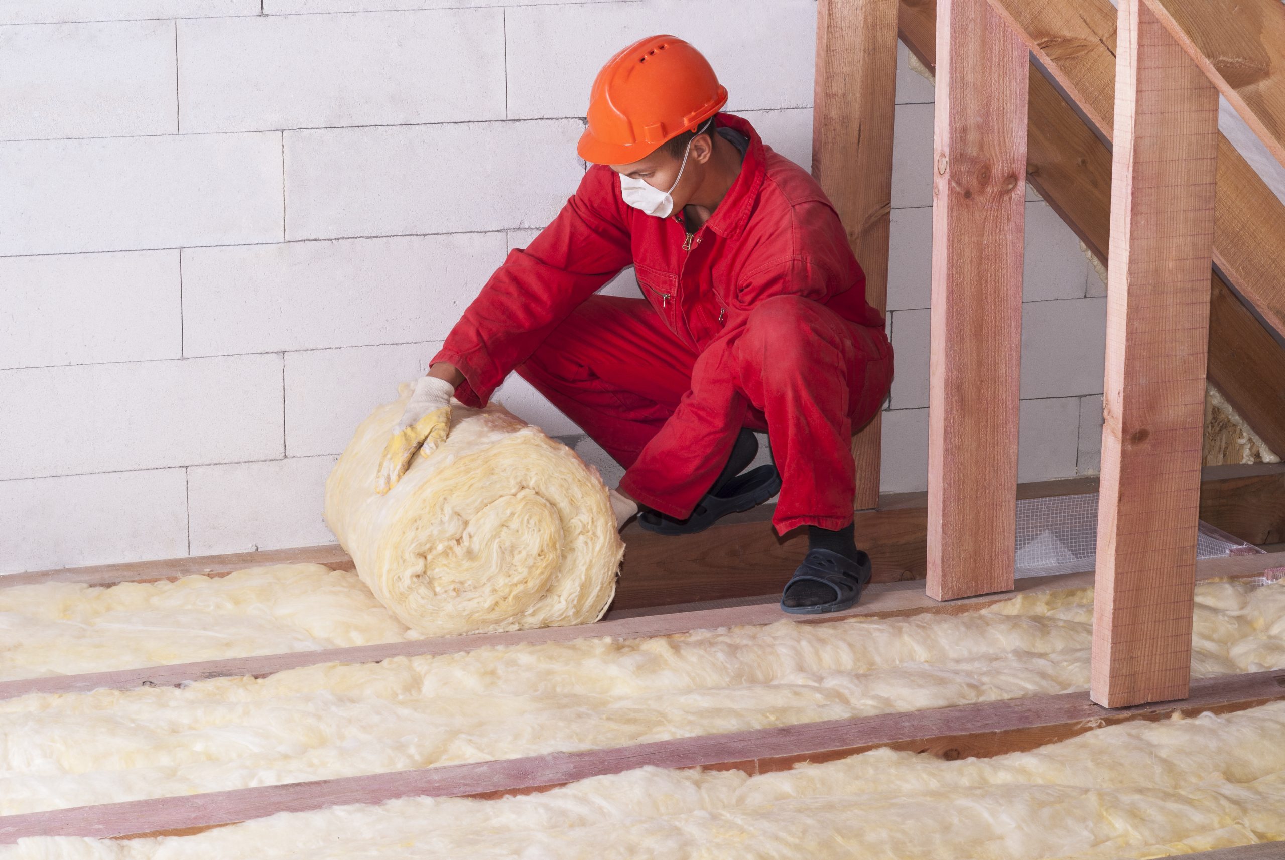 Contractor installing insulation