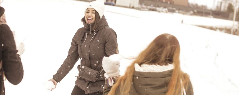 Students throwing snow balls.