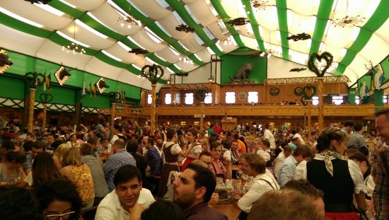 Festival tent full of people.